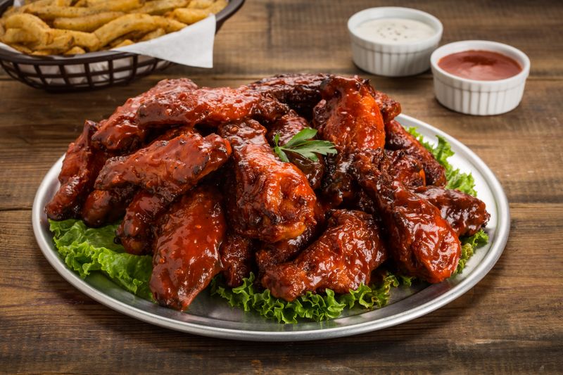 Buffalo wings with blue cheese dipping sauce